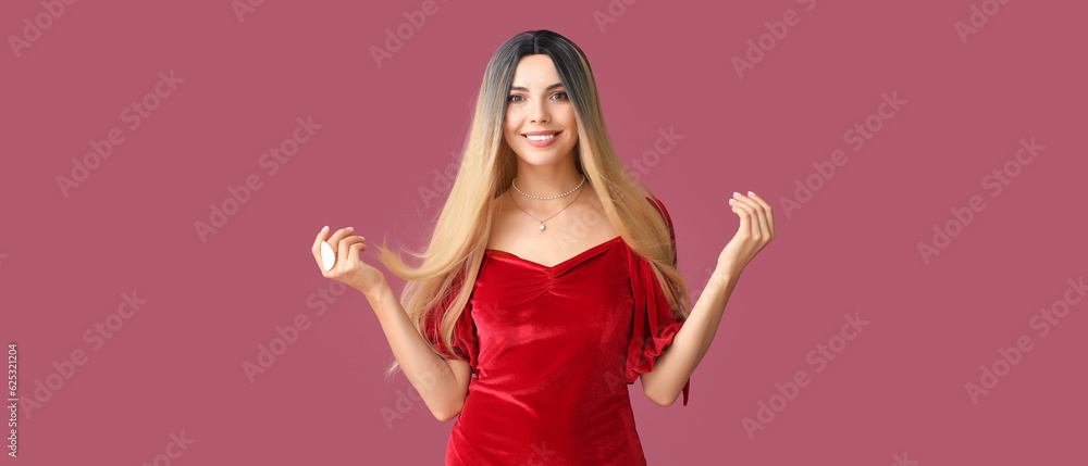 Beautiful young woman in stylish wig on pink background Beautiful young woman in stylish wig on pink background
