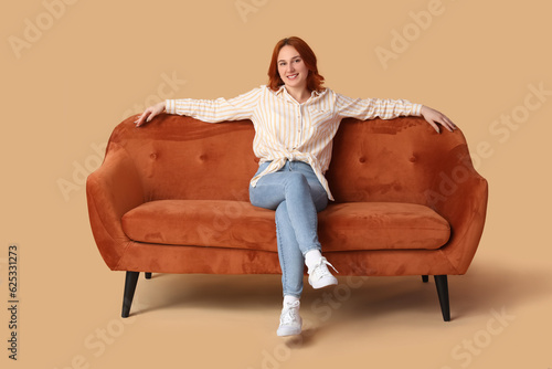 Young woman resting on sofa...