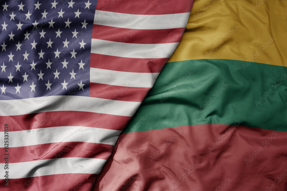 Obraz premium big waving colorful flag of united states of america and national flag of lithuania .