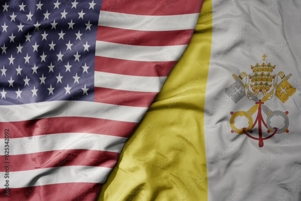 Obraz premium big waving colorful flag of united states of america and national flag of vatican city .