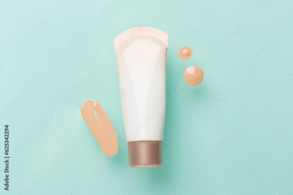 Obraz premium Composition with makeup foundation on color background, top view
