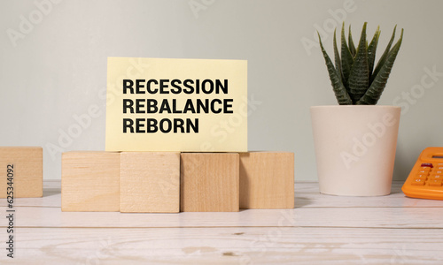 Fototapeta Naklejka Na Ścianę i Meble -  Wooden blocks with words 'Recession Rebalance Reborn'.