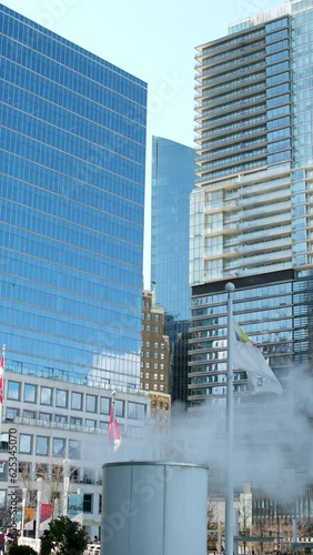 Wallpaper Mural Vancouver city center Waterfront office buildings Canada Place Pacific Ocean people walking on port traffic skyscrapers tourists Real life in big city Vancouver 2023 Torontodigital.ca