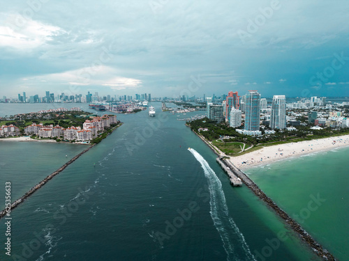 Fisher Island skyline with buildings seen from bay in South Beach. Miami Beach and Fisher Island aerial view. Luxury apartments on Fisher Island. Fisher Island from South Point Park Miami. © Volodymyr