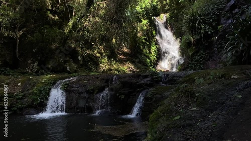 panorama of unique elabana falls in lamington national park, south east queensland, australia; beautiful waterfall in dense gondwana rainforest near gold coast and brisbane photo