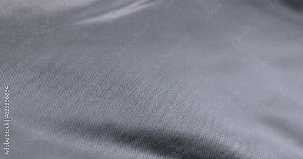 crumpled gray material in close-up, part of the fabric from gray-tinged clothing crumpled gray material in close-up, part of the fabric from gray-tinged clothing
