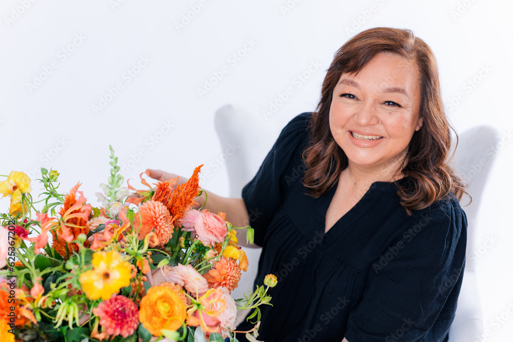 portrait of a woman with flowers against white background