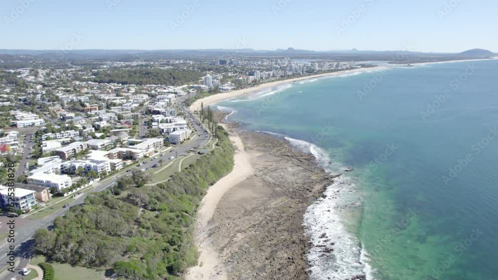 Aerial View Of Alexandra Headland Coastal Suburb And Beach On A Sunny Day In Queensland, Australia. Aerial View Of Alexandra Headland Coastal Suburb And Beach On A Sunny Day In Queensland, Australia.