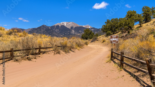 Point of No Return - A bright sunny Spring day at the entrance of a treacherous sandy desert road, with Mt. Herald towering in background. Great Sand Dunes National Park, Colorado, USA. photo