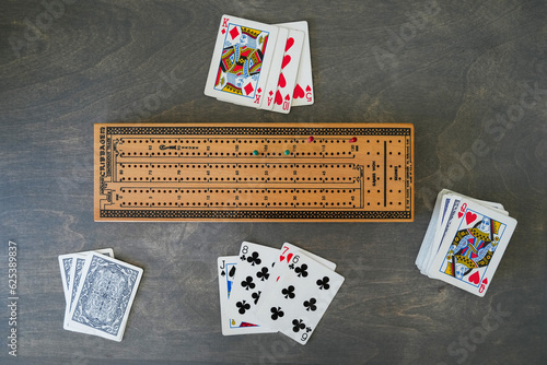Overhead view of cribbage board and cards photo