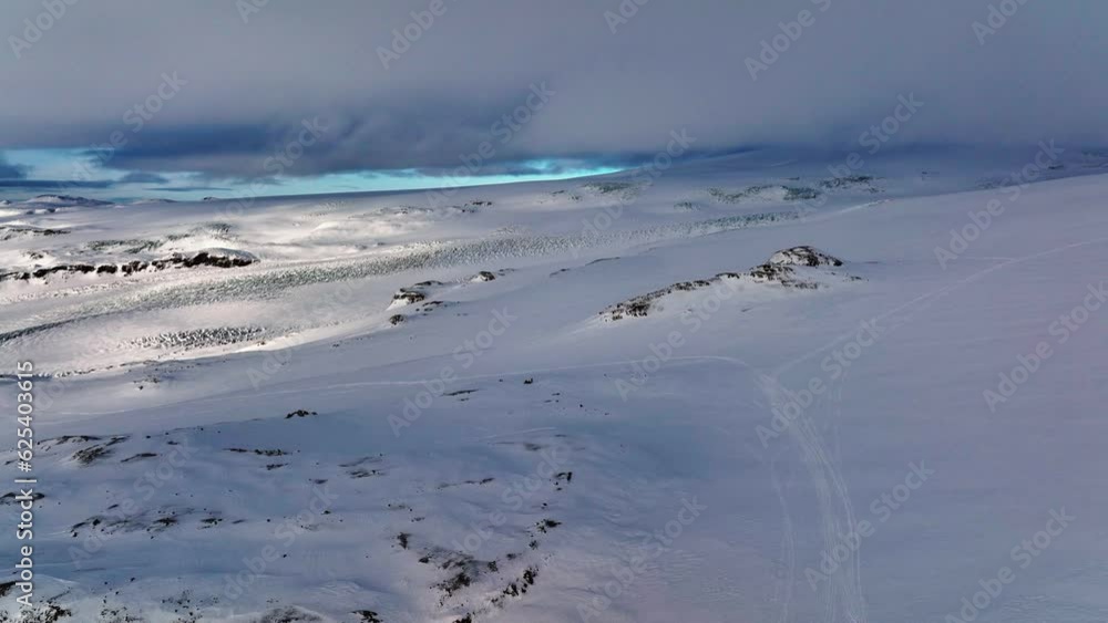 Aerial panoramic landscape view of Myrdalsjokull glacier covered in snow in Iceland, on a cloudy evening Aerial panoramic landscape view of Myrdalsjokull glacier covered in snow in Iceland, on a cloudy evening