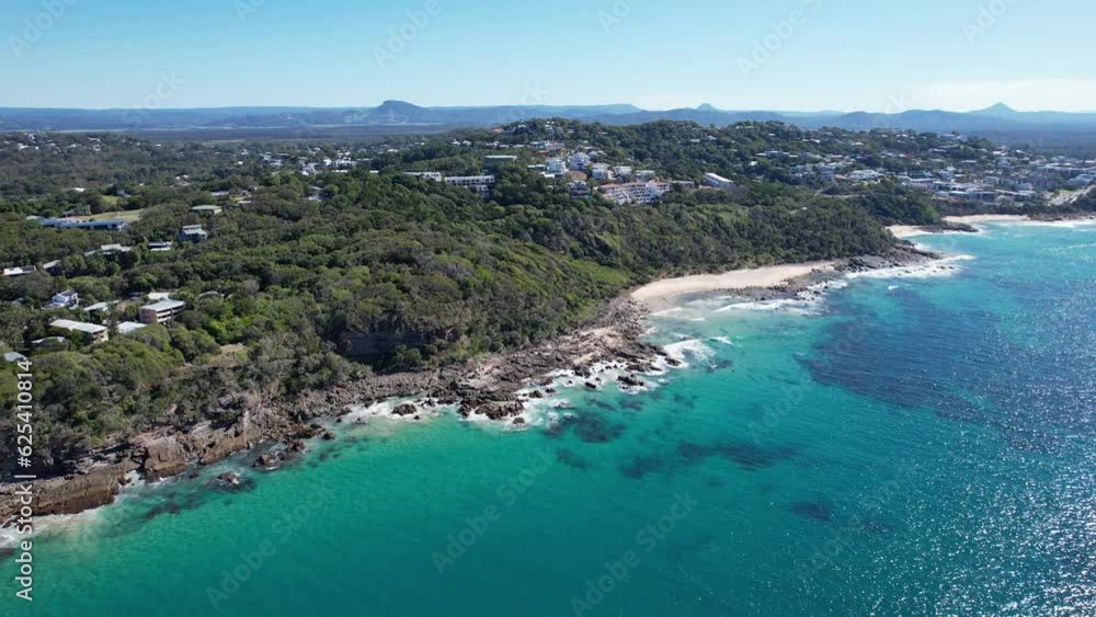 Coastal Haven In The Bays Of Coolum In Queensland, Australia. aerial sideways Coastal Haven In The Bays Of Coolum In Queensland, Australia. aerial sideways