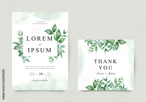 Elegant wedding invitation card with green foliage