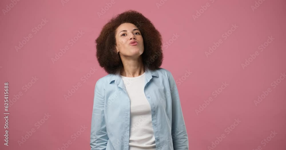 Happy african american woman pointing empty advertising area for commercial text inscription place over head, copy-space for promotion banner isolated on pink studio background Happy african american woman pointing empty advertising area for commercial text inscription place over head, copy-space for promotion banner isolated on pink studio background
