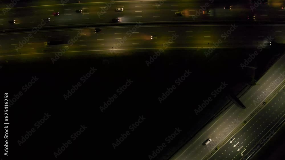 Top view, zoom out of Cars moving on highway in Malaysia at night. 4K, Slow motion, copy space Top view, zoom out of Cars moving on highway in Malaysia at night. 4K, Slow motion, copy space