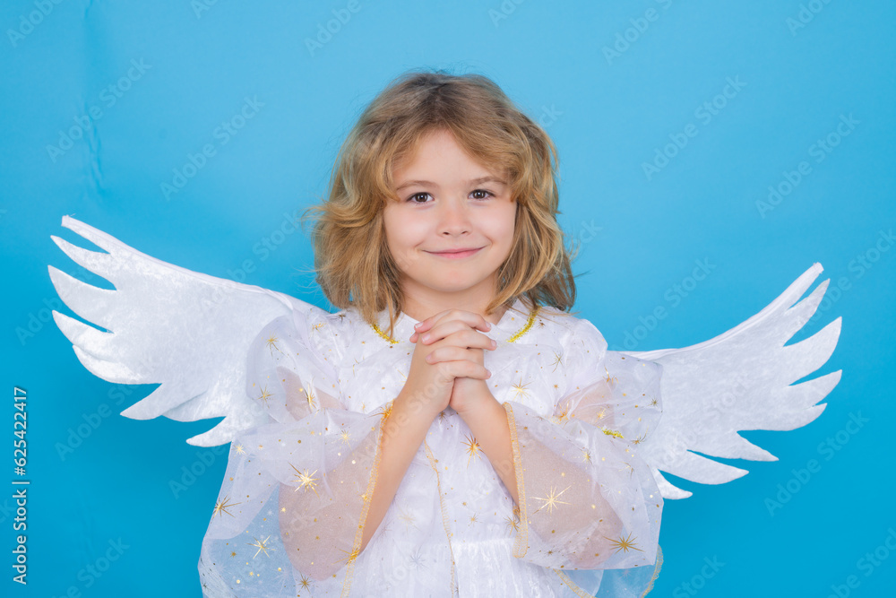 Valentine angel. Little cupid child. Kid angel with angels wings, isolated on blue studio background. Valentines day gift card. Valentine angel. Little cupid child. Kid angel with angels wings, isolated on blue studio background. Valentines day gift card.