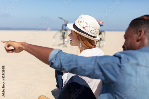 couple went to the beach to enjoy the sea breeze