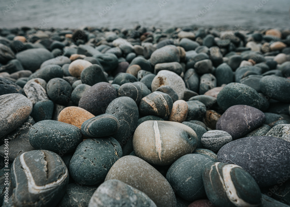 Close up of colorful smooth rocks on beach in Newfoundland, Canada. Close up of colorful smooth rocks on beach in Newfoundland, Canada.