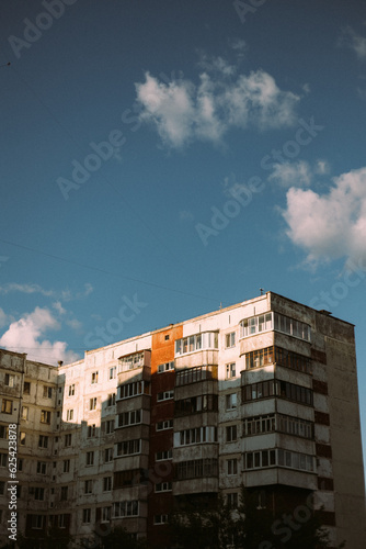 Multistory building in sunlight and clouds