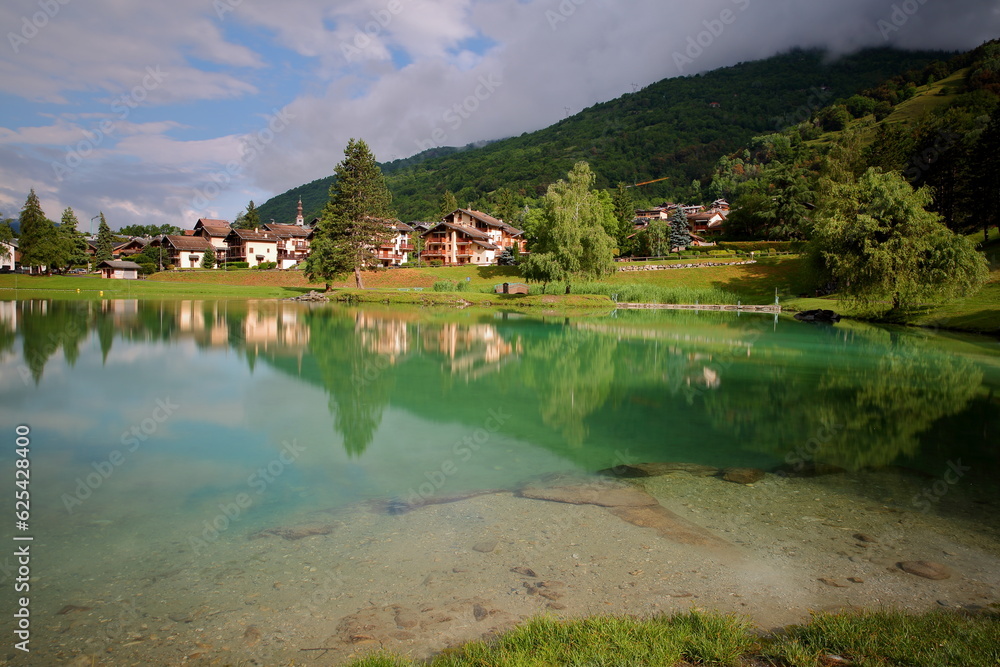 Reflections of the colorful lake of the commune Bozel, Northern French Alps, Tarentaise, Savoie, France