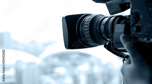 Closeup of television operator with camera photo