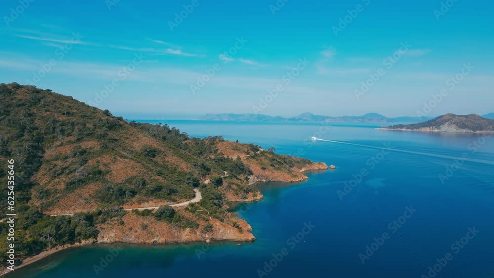 Aerial view of coastline Aegean sea in Turkey with winding seashore road Aerial view of coastline Aegean sea in Turkey with winding seashore road