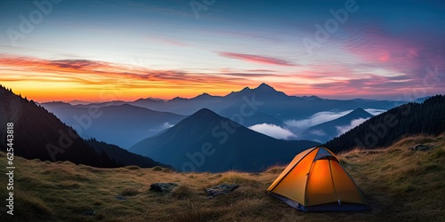 Outdoor travel and adventure. Camping lifestyle in mountains. Tent and landscape background