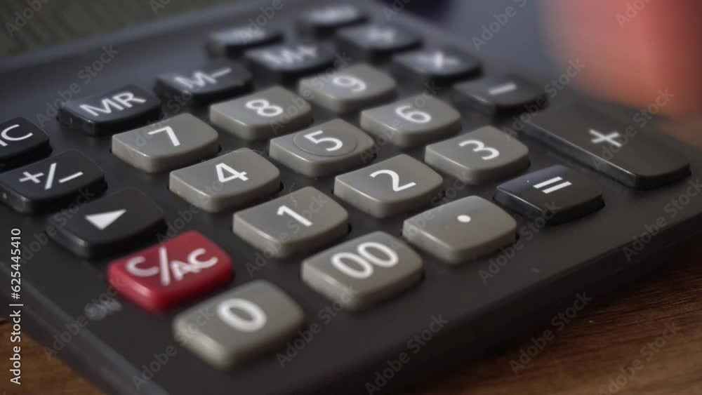 Calculating Taxes With Money And Calculator Calculating Taxes With Money And Calculator