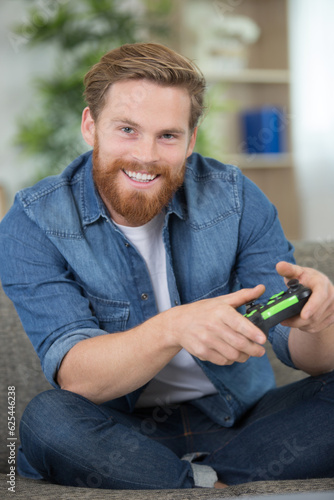 happy man with video game controller