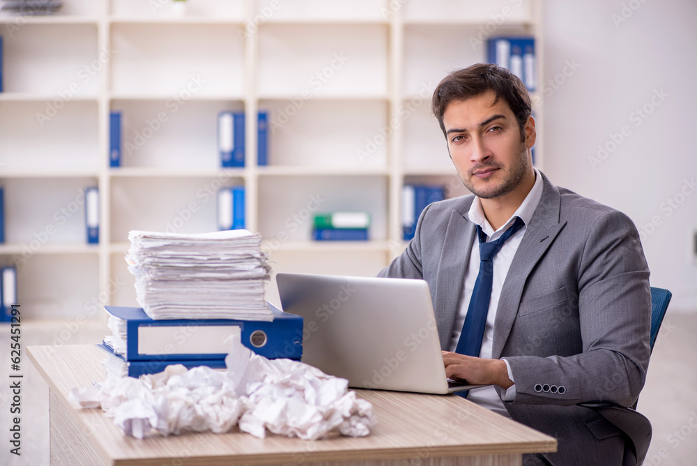 Young male employee in brainstorming concept Young male employee in brainstorming concept