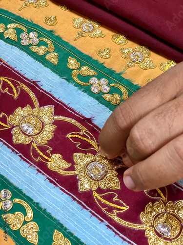 embroidering fabric with gold thread
