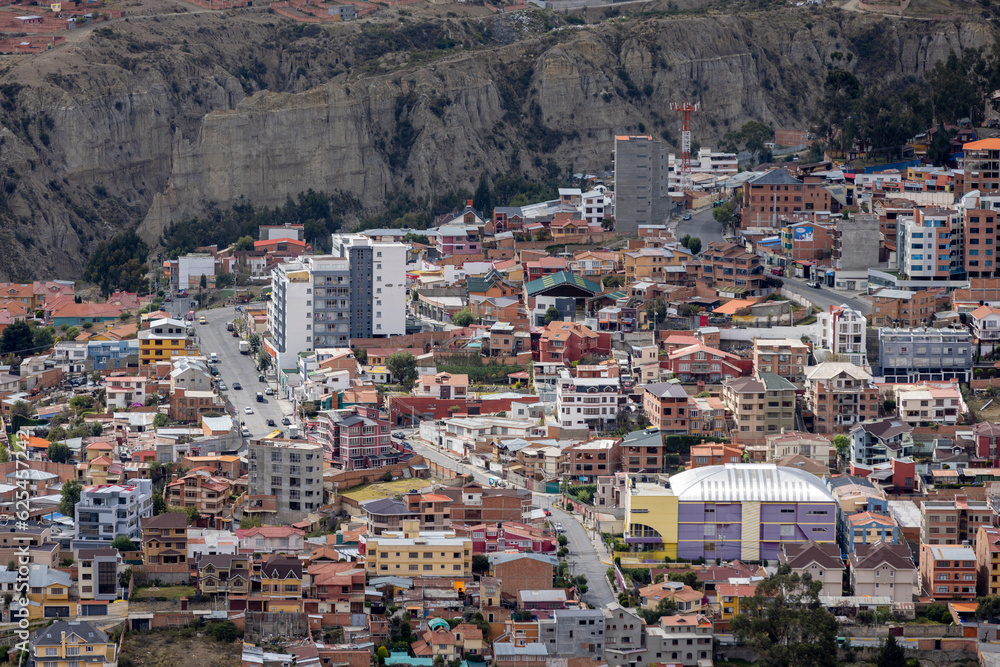 View from the scenic road to the landmark Muela del Diablo over the highest administrative capital, the city La Paz and El Alto in Bolivia - close up of hundreds of houses