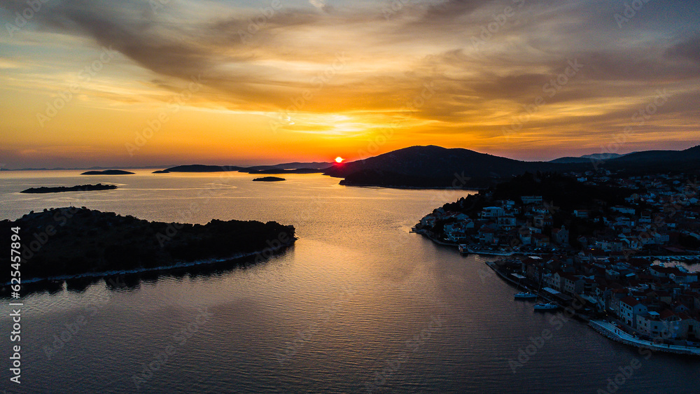 Sunset Drone areal view over islands. Church. Croatia