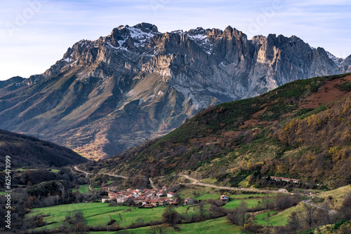Western massif of the Picos de Europa National park and the village of Santa Marina placed in the Valdeon valley at sunrise, Leon, Spain.