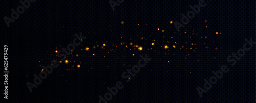Golden sequins glow with many lights. Glittering dust. Luxurious background of golden particles.