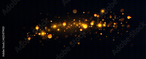 Golden sequins glow with many lights. Glittering dust. Luxurious background of golden particles.
