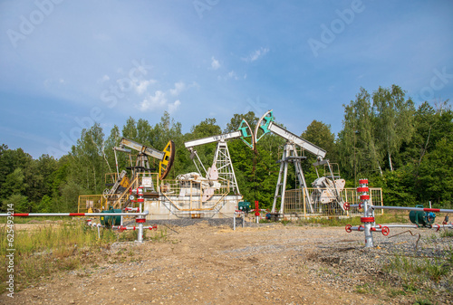 Gas production plant. the inscription in Russian "ATTENTION! Automatic start" and "Hydrogen sulfide is DANGEROUS!"