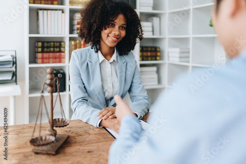 african american attorney, lawyers discussing contract or business agreement at law firm office, Business people making deal document legal, justice advice service concepts photo