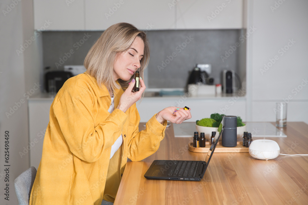 work from vacation home, remote workers. woman using a laptop and resting uses essential oils and enjoying fragranceof your apartment. Working from Anywhere. work from vacation home, remote workers. woman using a laptop and resting uses essential oils and enjoying fragranceof your apartment. Working from Anywhere.