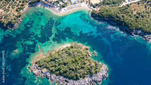 Aerial view of Luxury resort with swimming pools on a palm fringed beach, aerial view, Greece, Epirus. 