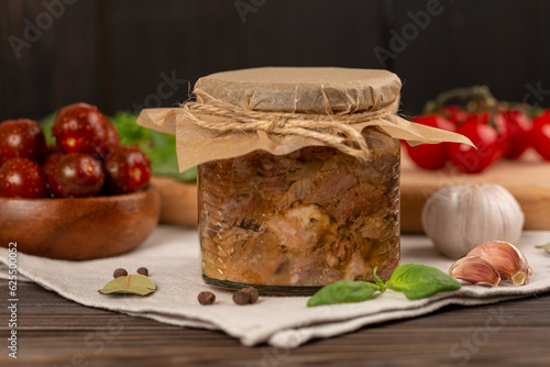Homemade pork stew in a glass jar, fresh canned, stewed meat