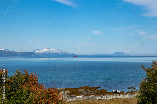 Stunning view of mountains and fords in Norway.Lattervik, red ship