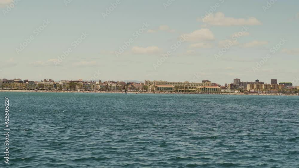 Panoramic view of Malvarrosa beach from the sea on a sunny summer day. Panoramic view of Malvarrosa beach from the sea on a sunny summer day.