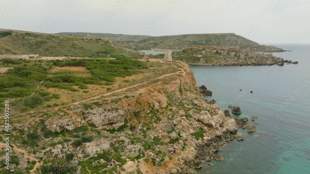 Drone nature landscape view of old tower, beach sea. Malta Drone nature landscape view of old tower, beach sea. Malta