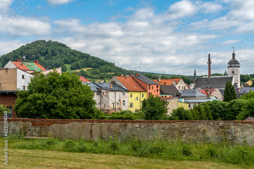 Ruins of Castle Kamenice and the town of Ceska Kamenice in Czech Republic seen from the park
