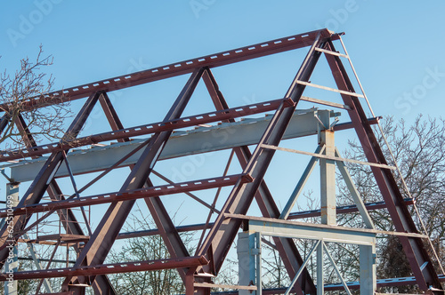 Construction of a hangar made of metal structures. Frame made of steel I-beams