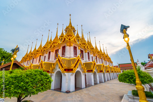 Photography Golden metal castle illuminated, Wat Ratchanatdaram Woravihara, Loha Prasat temp