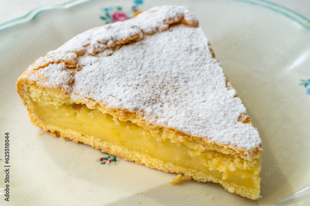 A piece of Custard cream cake with pine nuts. Traditional italian cake - torta della nonna or grandmother's cake. Tuscany pastry. A piece of Custard cream cake with pine nuts. Traditional italian cake - torta della nonna or grandmother's cake. Tuscany pastry.