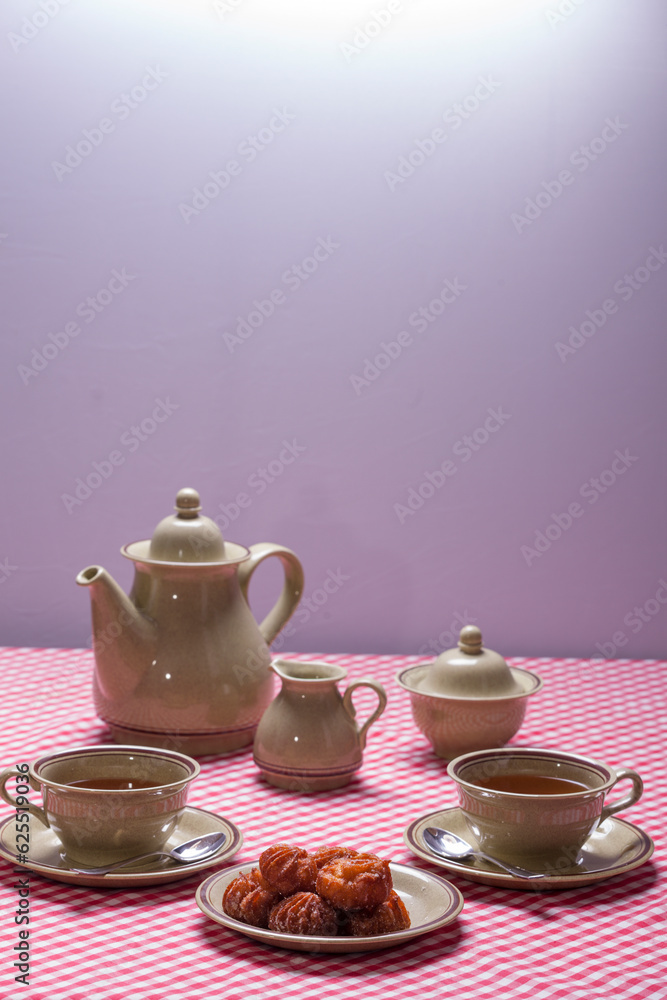 Fototapeta premium table prepared for snack, for two, lenten fritters, holy week.