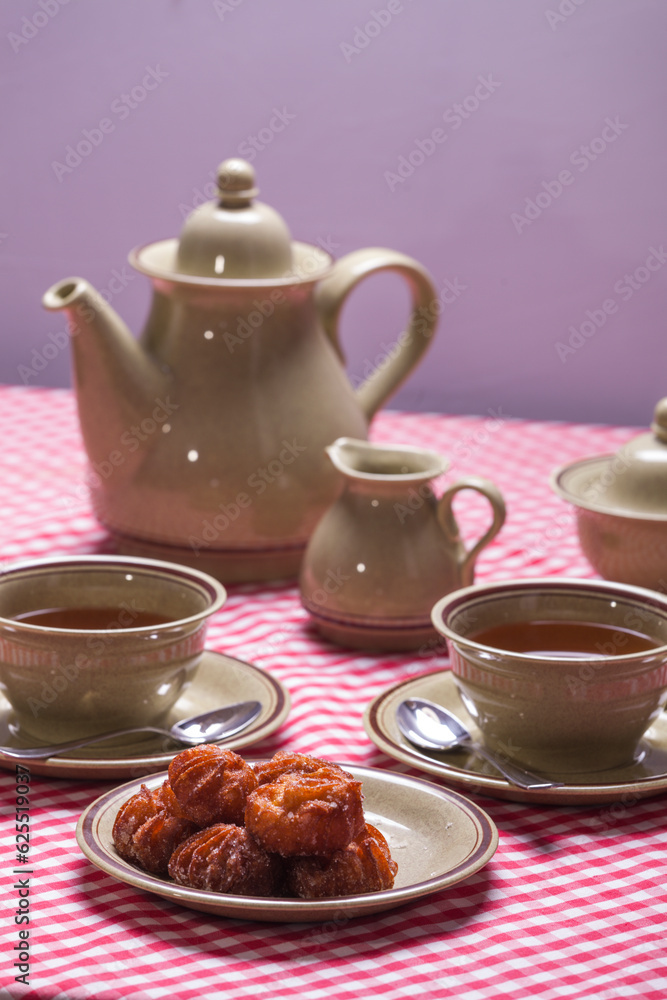 table set for snack, for two, lenten fritters, easter. close up table set for snack, for two, lenten fritters, easter. close up